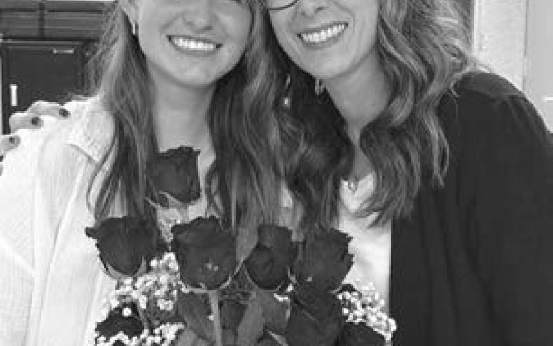 Meredith Maciejewski (left) was acknowledged with 13 roses for her 13 years in lessons. She has been taking lessons since she was in Kindergarten. She will have her Senior Recital June 1 at 2:00 in the school theater.