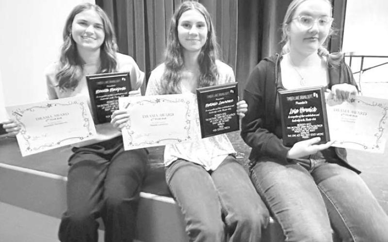 Three TLHS seniors received plaques for participating in drama for four years. L-R are Meredith Maciejewski, Natalie Lawrence, and Lola Hornick. Drama advisor Heather Kraft presented the awards.
