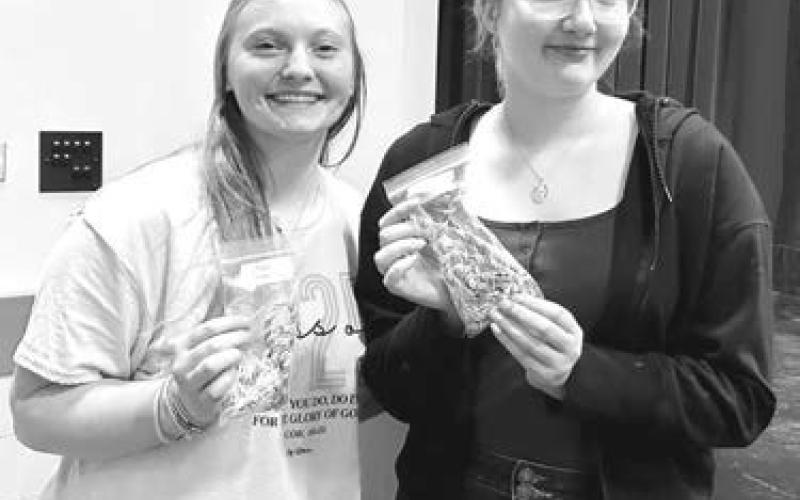 Educators Rising graduation cords were presented to seniors Jordan Jones (left) and Lola Hornick by advisor Luann Lindskov. The organization is for students who plan to major in education.