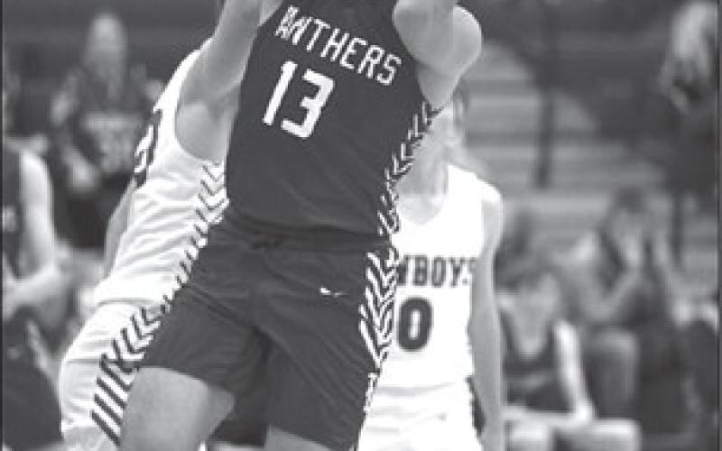 Panther forward Aidan Rough Surface puts up a running jumper during second round action of the LMC Tournament against Lemmon last Friday, Feb. 2. Rough Surface finished the game with a season-high 20 points. Photo by Marie DuPreez