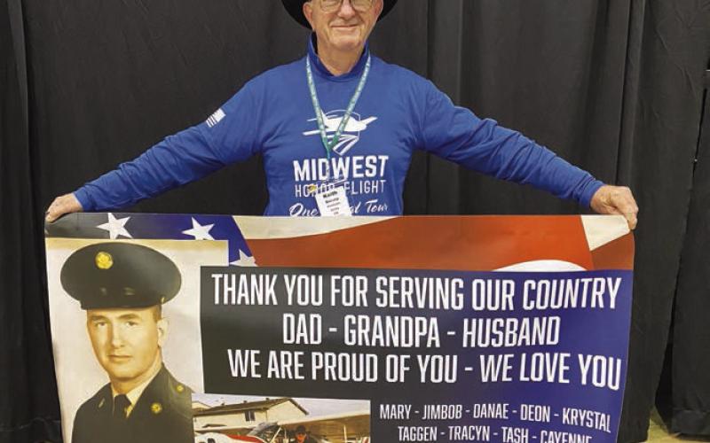 Keith Dorsey of Isabel with the banner his family presented to him.