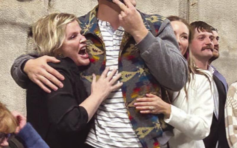 TLHS alum Tucker Kraft embraces his mother (left), Tausha, and fiance, Baylee Jandahl, as his name is announced as the 78th selection in the 2023 NFL Draft. The SDSU tight end was picked by the Green Bay Packers. Watching the announcement at right are Kraft’s brothers, Tanner and Cody. Photo by Jon Flatland