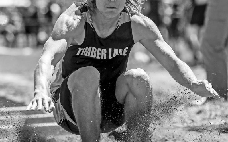 TLHS junior Chase Marshall sticks a landing in the long jump. After winning the region meet, Marshall competes in the event at state this weekend. Photo by Robert Slocum