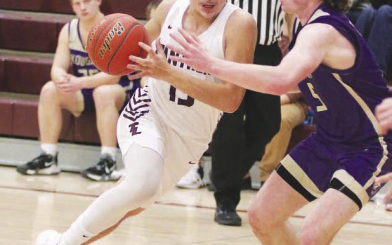 Timber Lake junior forward Aidan Rough Surface drives the lane on an unidentified Kadoka Area defender during non-conference boys basketball action last Tuesday, Jan. 24. Kadoka handed the Panthers their fifth loss of the season. Photo by Jon Flatland