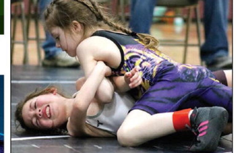 Above, Dupree’s Paizley Holmes (right) has Timber Lake’s Ramzi Veit in a tough spot during their match last Friday. Holmes went on to earn the victory. Below, Ryder Spiel (left) attempts a fireman’s carry on Chandler Farlee of Dupre during their Panther Invite matchup.