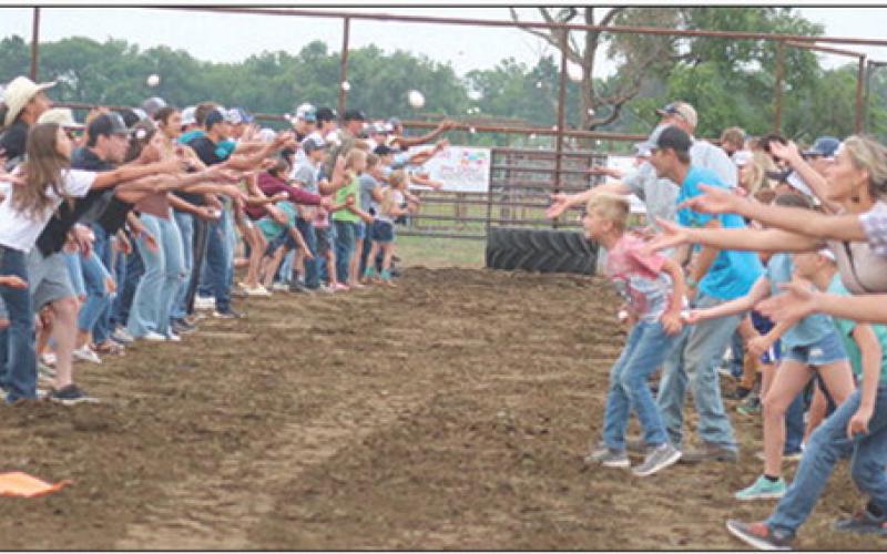 ABOVE: The egg toss at the Days of 1910 Demolition Derby drew a large number of participants this year. It ended in a three-way tie.