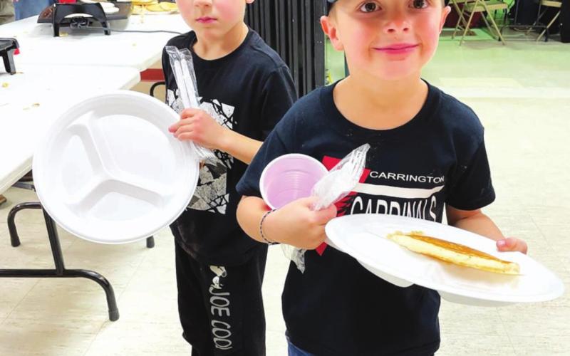 AT RIGHT: Two of John and Patty Linderman’s grandsons enjoyed the pancakes and (Grandpa John’s) sausage. Oliver McComsey (LEFT) is from Aberdeen and Ashton Linderman is from Carrington, ND.