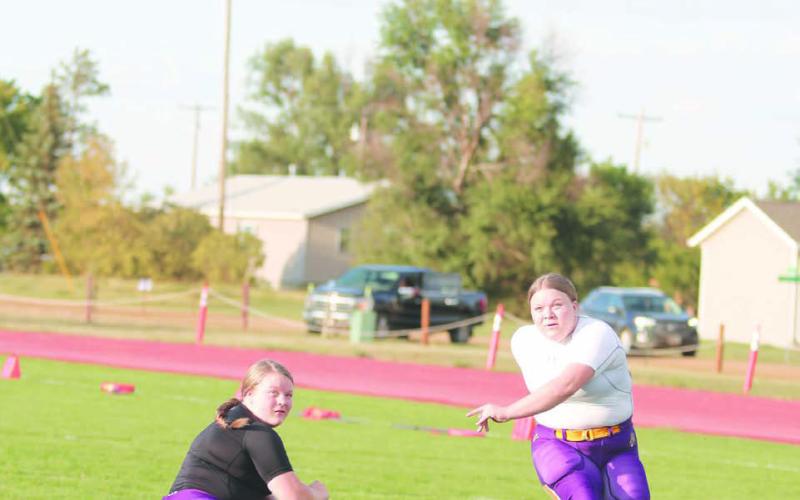 Twin sisters Cassidy and Carsyn Farlee - former youth soccer players - handle extra-points and field goals for the Dupree Tiger football team. Photo by Jon Flatland