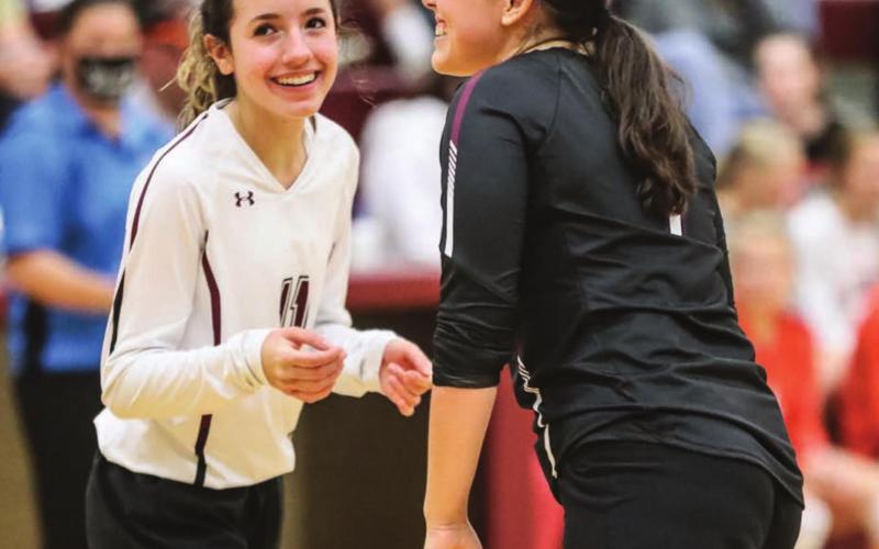 Panther volleyball players Rachel Toviah (L) and Tia LeBeau share a laugh during a recent volleyball match. Photos by Robert Slocum