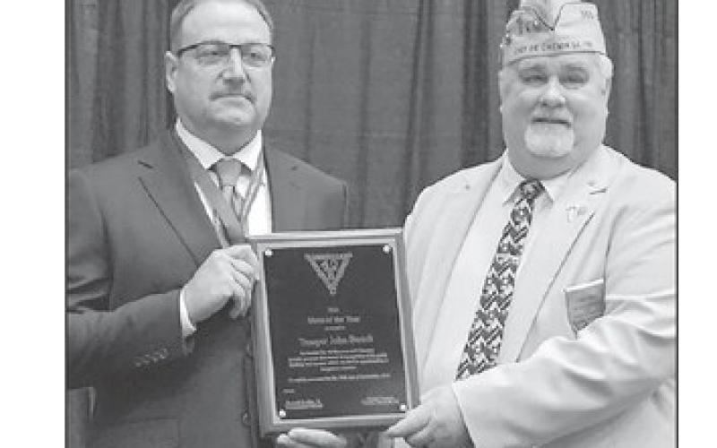 Chef de Chemin de Fer Frank Campo, right, National President of the Society of the Forty Men and Eight Horses, presents the Hero of the Year award to Trooper John Berndt last month. Berndt is a 1997 graduate of McIntosh High School.