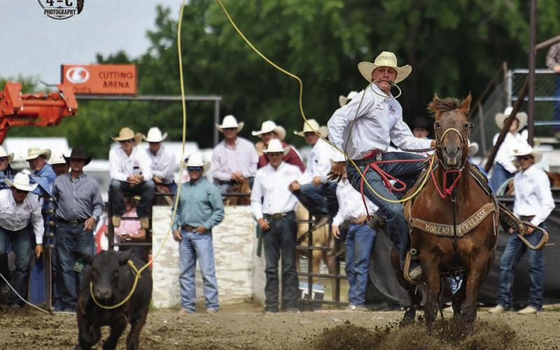 Hayes Burress of Isabel collected a performance win in tie-down roping at the National High School Finals Rodeo in Lincoln, NE, last week, with a 9.3 second run. Burress finished sixth overall in the nation. Photo by Chuck Miner