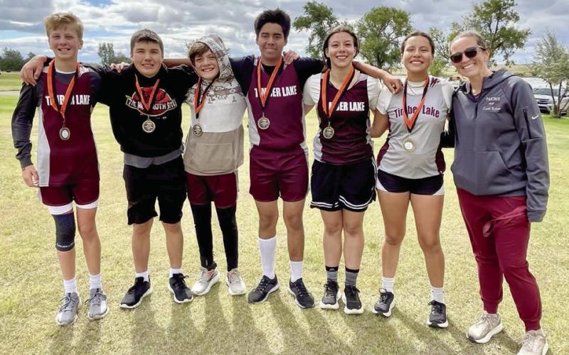 The Timber Lake cross country team had a big day at the Marlene Gustafson/Ryan Day Memorial Cross Country Meet in Faith on Friday, Sept. 5, with every member medaling in their division. (l-r) Gracen Gill, Ben Petersen, Mason Kraft, Theo Taylor, Cheyienna Nygaard, Tessla Taylor and Coach Alision Nilson.