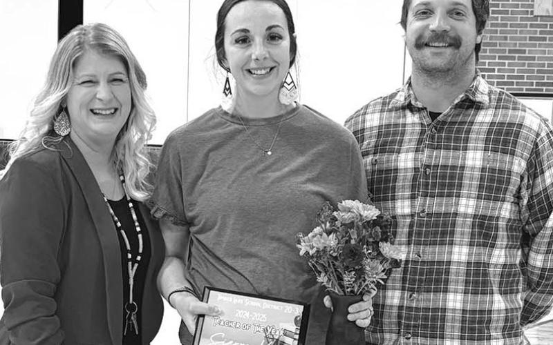 Timber Lake Teacher of the Year Sierra Kraft (middle) with her husband Tanner and Elementary Principal Danae Paxton (left)