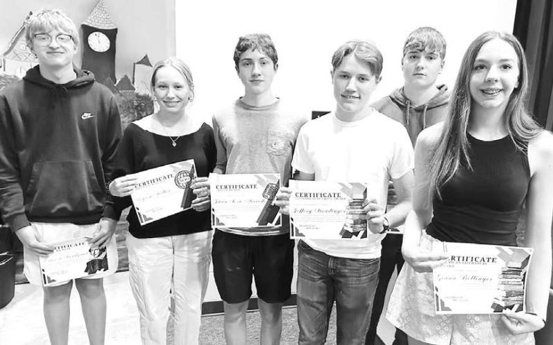 Megan Bickel presented English awards to these high school students (L-R): Carsen Sandquist, Peyton Keller, Juan Sosa Acevedo, Jeffery Stradinger, Kolby Holzer, Geana Bollinger