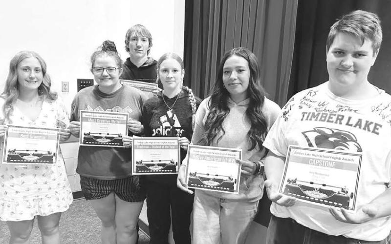 Karyl Boldt presented English awards to these high school students at TLHS Awards Day. (L-R): Emma Johnston – Best Grammar; Molly Miller – Most Creative Writing; TJ Alley – Best Neutrality in an Informative Essay; Kadence Ouzts – Rising Star (freshman); Kessa Bigger – Native American Literature MVP; and Riley Montgomery – Capstone.