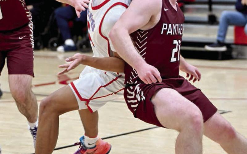 Timber Lake seniorTreyton DuPreez (right) and C-EB’s Jayden Marshall (left) battle for rebounding position during the Panthers’ loss to the Class A Braves last Tuesday, Feb. 18. See more Timber Lake boys basketball coverage on Page 10. Photo by Marie DuPreez