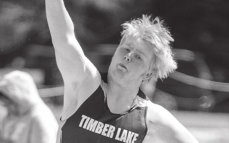 Shawn Quinn heaves the shot put.