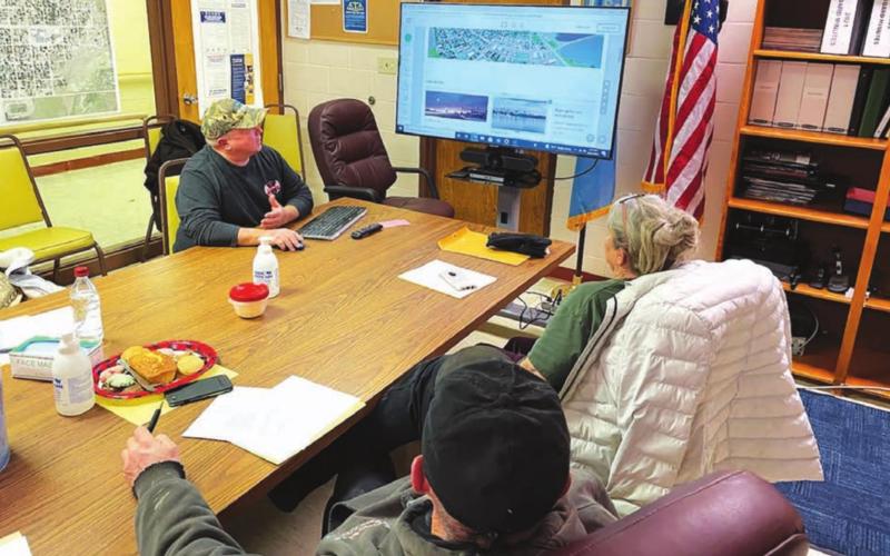 Roger Lawien gives the Timber Lake City Board a peek at the new city website he is helping to build.
