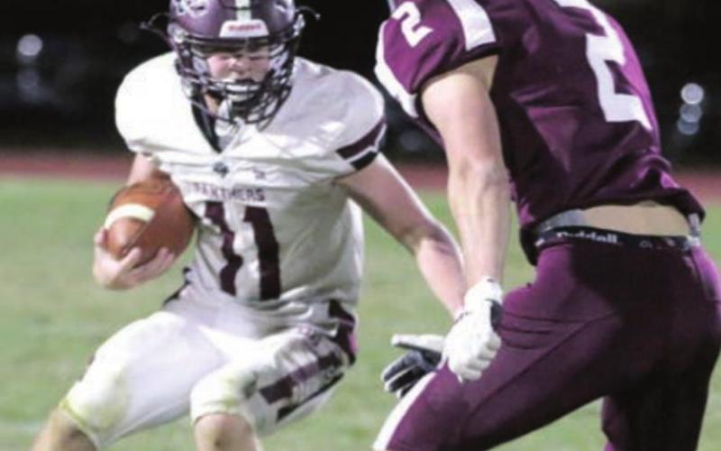 ABOVE: Timber Lake senior Brandt Ducheneaux closes in on a backfield tackle.