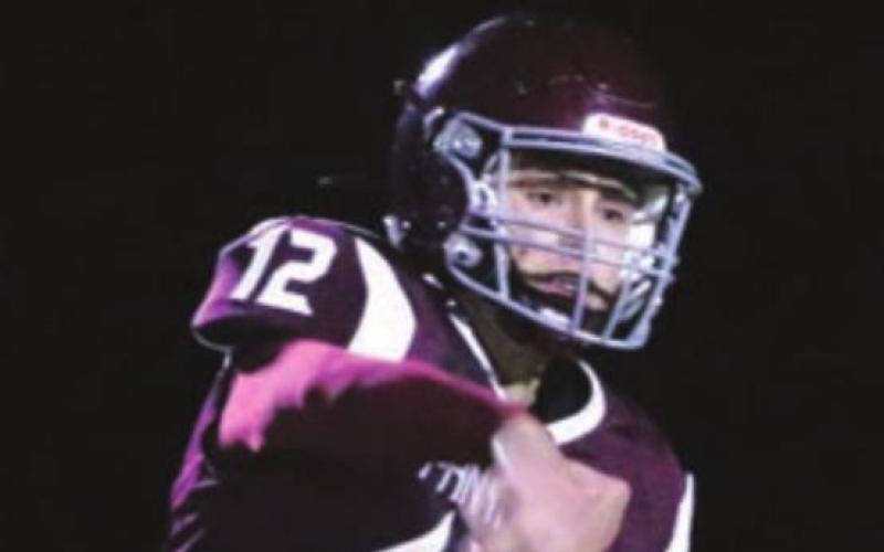 RIGHT: Panther quarterback Kedrick Martin rifles a pass over the P-G defense.