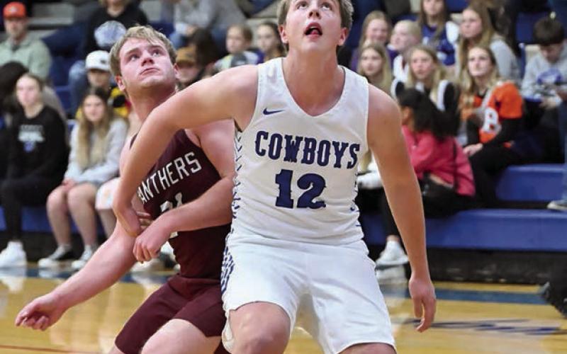 Timber Lake senior Treyton DuPreez, left, jockeys for rebounding position with Jacob Sonsalla (12) of Lemmon Topic photo by Marie DuPreez