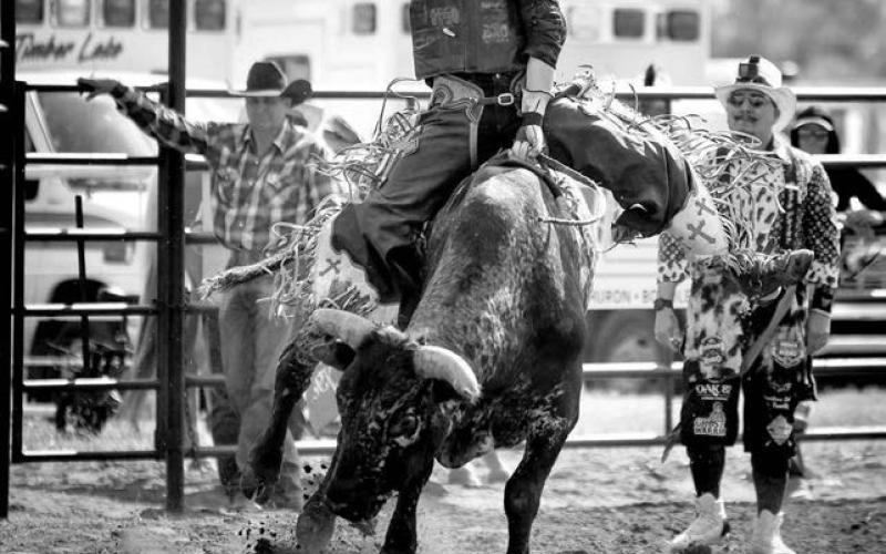 Fallon Peterson of Dupree (above) won the girls breakaway roping event with a blistering time of 3.21 seconds and Jerin Capp of Faith was the lone qualifier in bull riding at the Dewey County 4-H Rodeo. Photos by Chuck Miner