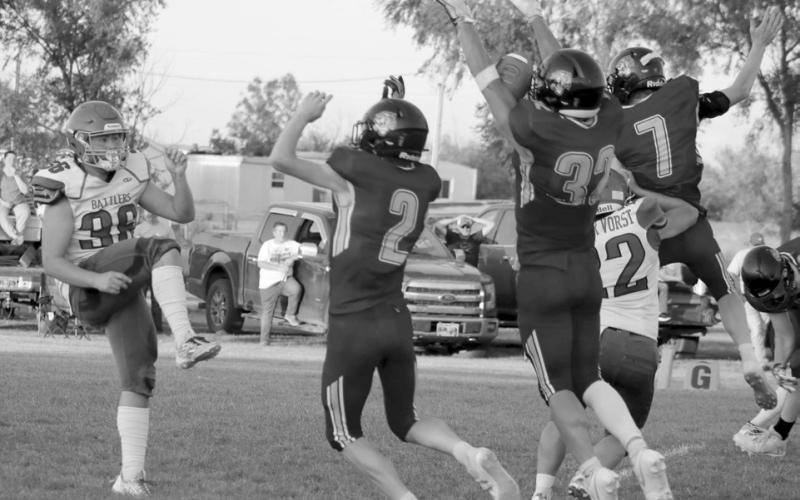 Braydon Terveen-Smith (32) blocks a Potter County punt during the Dupree Tigers win over the Battlers last Friday, Sept. 13. Rushing the punter with him were Cruz Birkeland (2) and Fletcher Birkeland (7). Cruz Birkeland ended up scooping up the blocked kick and tumbling into the end zone for a touchdown. Photo by Jon Flatland
