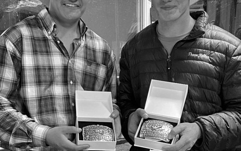 Bringing home some hardware from the Buckin’ on the River event in Ft. Pierre last weekend were Isaiah Ducheneaux, left, of Timber Lake and Thane Keller of Trail City. Ducheneaux won the bull poker event and Keller was the top bull rider with a 74 point effort. Photo courtesy of Buckin’ on the River