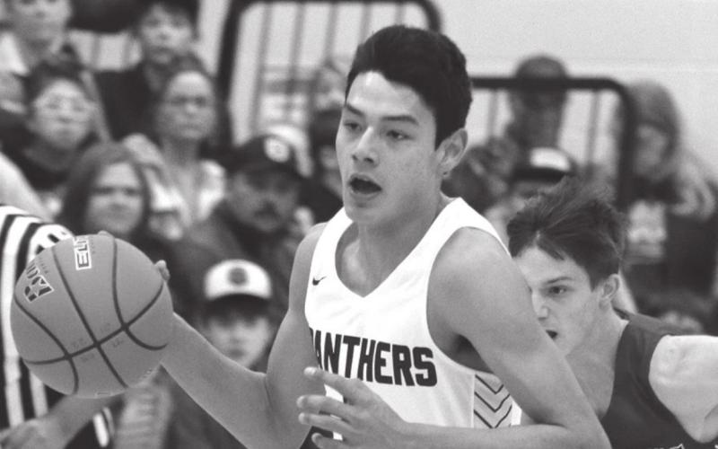 Timber Lake senior Chazz Gabe pushes the ball up the floor versus Lemmon.