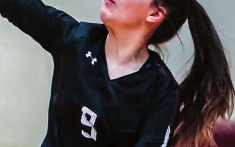 Abby Linderman makes a serve.