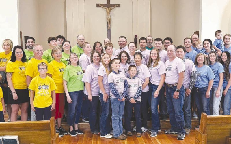 The Robert and Grace Alley children held a family reunion in Isabel on August 1 with 44 members present. This is the first time all the siblings have been together with their children and grandchildren. All 11 siblings graduated from Isabel High School along with their mom, Grace Whitehead Alley, and Mary's four children. Pictured are: Patty's family in yellow; John's family in green; Mary's family in purple; Tim's family in blue; back row, Bob in grey and Mark in green.