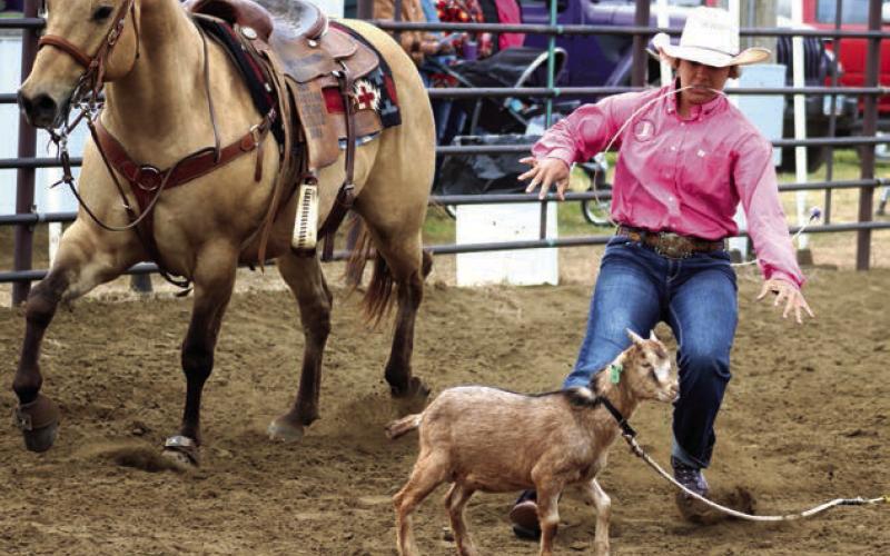 Riley Glines of McIntosh hit her dismount running and zeroed in on her target during the goat-tying event at the Dewey County 4-H Rodeo held in Timber Lake on Sunday, May 26. Photo by Jon Flatland