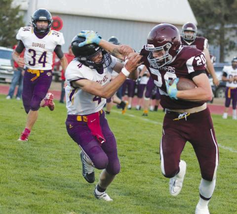 Timber Lake senior tight end Thane Keller stiff-arms Dupree defensive back Treg Thorstenson during the Panthers’ 38-0 homecoming win over the Tigers last Friday, Sept. 9. Keller finished with four receptions for 51 yards and a touchdown. Photo by Jon Flatland