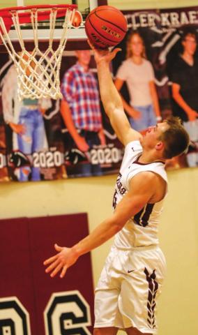 Hank Kraft lays in 2 points for the Panthers. Photo by Robert Slocum