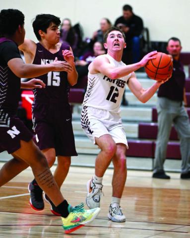 Junior guard Cole Ducheneaux drives to the hoop during the Panthers 83-19 win over Newell last week. Duchenaux finished the contest with eight points. Photo by Marie Du Preez