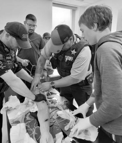 For the second year, South Dakota Emergency Medical Services for Children partnered with local Pediatric Champions and driver’s education instructors to present “Choices, Chances, Decisions (CCD)” and “Stop The Bleed (STB)” curriculum last Thursday, June 5, at the Timber Lake School. Above, Dewey County Deputy Chandler Ross teaches students how to apply a tourniquet during the Stop the Bleed program.