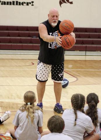 John “Sarge” Siers led a basketball camp for players of all ages at the Timber Lake School recently with dozens of kids attending. Siers is a teacher and head basketball coach at Ocoee High School in Florida who has coached at all levels and conducted youth basketball camps across the U.S. for more than 40 years. Photo by Jon Flatland