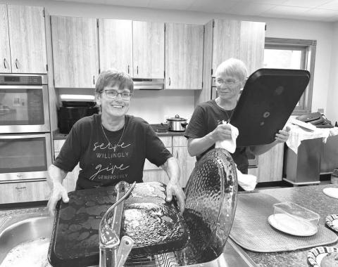 Holy Cross Catholic Church hosted its annual bazaar on Sunday, September 13, with a meal, games, and silent auction. Afterwards there was cleaning up to do. Renee Leibel (left) and Donna Aberle helped with the dish washing.