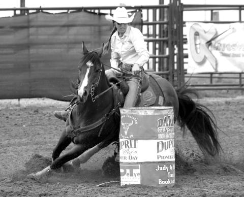 Minda Woodward of Dupree , current South Dakota Rodeo Association (SDRA) season point leader in barrel racing, competes at a recent event in Dupree. Photo by Jon Flatland