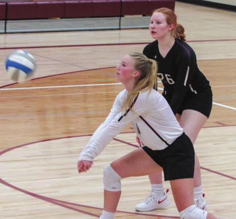 LEFT: Timber Lake’s Avery Marshall (FRONT) and Brenna Atchley (26) play defense in a recent junior varsity match.