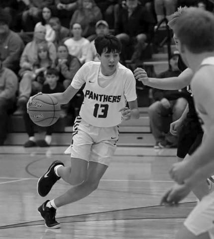 Freshman guard Jackson Bigger penetrates the lane during boys basketball action against Ipswich on Saturday. Timber Lake beat the Tigers and North Central last week to improve to 3-2 on the season. Photo by Marie DuPreez