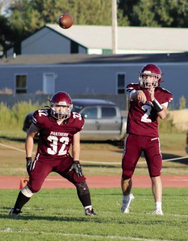 Timber Lake quarterback Cole Ducheneaux (2) fires a pass over the middle while running back Gabe Keller (32) stands guard in pass protection. Ducheneaux threw for two touchdowns and ran for another as the Panthers got past North Central 20-6 last Friday at Kraft Field.