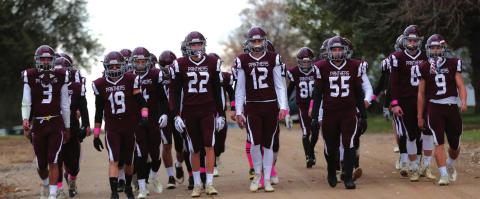 The Panthers walk to the field together for their opening round playoff win over Leola-Frederick. Photos by Jon Flatland