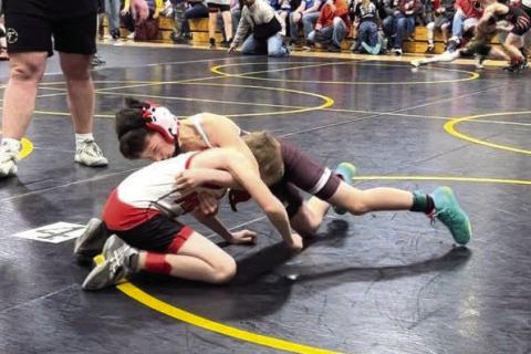 Shayde Curley (in maroon) works to get position on an opponent during recent youth wrestling action. See how wrestlers from Timber Lake, Dupree and McLaughlin fared in last Sunday’s Mobridge Youth Wrestling Invitational on Page 7B. Courtesy Photo