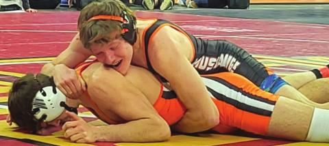 Timber Lake junior Thane Keller rides an opponent during a match at the South Dakota High School Class B Wresting Championships in Sioux Falls last weekend. Wrestling at 160-pounds, he is the first-ever Timber Lake HS student-athlete and just the third team member in Mustang wrestling program history to compete at the state tournament. Keller finished the tournament 1-2 and ended his season at 16-6 overall. Photo by Kyle Henderson
