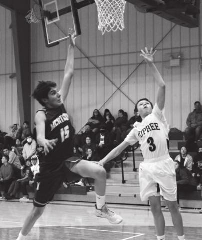 Klayte McLellan, in the ninth grade, had McIntosh’s Ashton Walker on his tail as he was making points for Dupree’s JV team as they beat the McIntosh Tigers 51 to 15. Photo by Patty Peacock