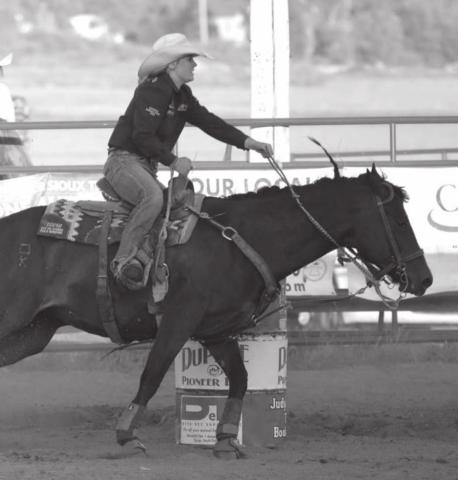 Kesse Deal competes in the barrels at the Dupree Pioneer Days rodeo. Photo by Jon Flatland