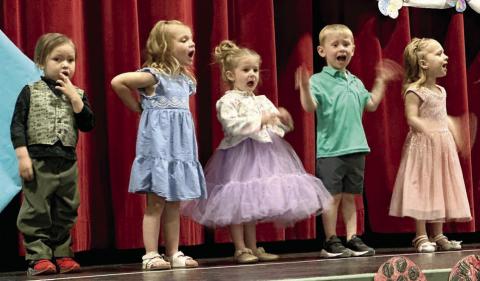 The Timber Lake Head Start kids presented their spring concert in the Timber Lake School theater last Thursday, April 30. Performers included (l-r) Jesper Four Bear, Reagan Kraft, Mia Linderman, Dexter Aberle and Kara Aberle. The stage was decorated with flowers, bumblebees and lady bug art created by the students. Photo by Kathy Nelson