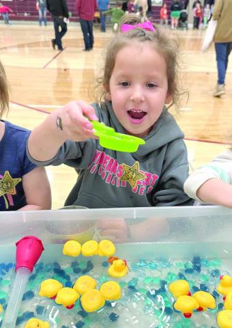Addy Curley had some fun fishing in the duck pond at the Timber Lake Elementary School’s Family Fun Night last Wednesday, March 19. More than 75 percent of the school district’s elementary school students attended the event. Photo by Kathy Nelson