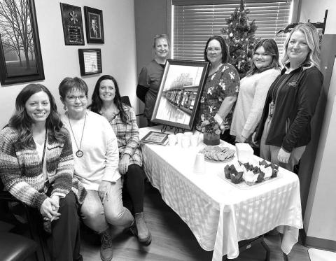 Kris Lawien was the guest of honor at an open house celebrating her retirement at West Dakota Health Center in Timber Lake on December 5. Staff from WDHC and Mobridge Regional Hospital were on hand to observe the special day. L-R are Nicole Schneider, Kris, Candida Goehring, Carol Geditz, Holly Keller, Mersedes Rough Surface, and Jodi Madison.